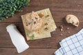 Stacked chocolate chip cookies with milk bottle on wooden table. Royalty Free Stock Photo