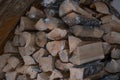 stacked chopped firewood under the stairs. Village life, fireplace or stove for heating.