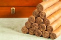 Stacked cigars and humidor Royalty Free Stock Photo