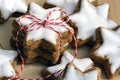 Stacked cinnamon stars packed with red and white ribbons