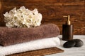 Stacked clean towels on wooden table