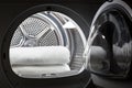 Stacked clean white towels inside washing machine drum. Clean concept. Laundry. Closeup of open washing machine Royalty Free Stock Photo