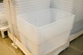 Stacked clear plastic storage bins on warehouse pallet Royalty Free Stock Photo