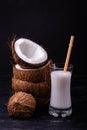 Stacked coconut, and coconut milk in the glass