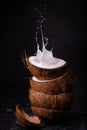 Stacked coconut, and coconut milk splash