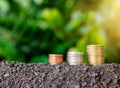 Stacked coin on soil for nature. Royalty Free Stock Photo