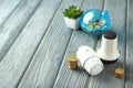 Stacked coins, piggy bank and thermostats on wooden table. Heating saving concept