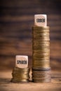 Stacked coins showing unjust difference between saving money and inheriting it Royalty Free Stock Photo