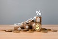 Stacked of Coins on table with percentage icon and Gray Background With Illustration Shows Increasing of Interest Rates Royalty Free Stock Photo