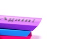 Stacked colorful erasers on a white background with text space. Printed word again on top eraser Royalty Free Stock Photo