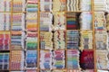 Stacked colorful Turkish towels in shelves