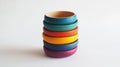 stack of colorful wooden bangles on white surface Royalty Free Stock Photo