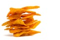 Stacked corn chips in a row on white background