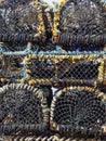 Stacked Crab and Lobster Pots in Close up on one of the Quays at Seahouses Harbour Royalty Free Stock Photo