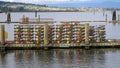 Stacked crab pot traps with colored floats on dock ready for crabbing Royalty Free Stock Photo