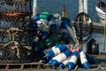 Stacked crab pots and a bundle of blue buoys In Tokeland marina Royalty Free Stock Photo