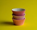 Stacked Cupcake Liners on Yellow Background Royalty Free Stock Photo