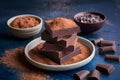 Stacked dark chocolate pieces paired with rich cocoa powder, decadent delight