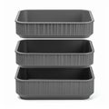 Stacked Dark Gray Plastic Storage Bins on White Background Royalty Free Stock Photo