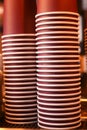 Stacked disposable cups in a cafe setting during the afternoon Royalty Free Stock Photo
