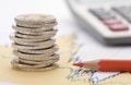 Stacked euro coins on table sheet