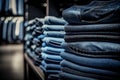 Stacked fashion jeans closeup. fashion clothes store concept