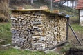 Covered, stacked, chopped firewood