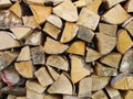 Stack of firewood, wood logs texture background.Pile of chopped fire wood prepared for winter