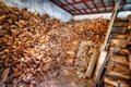 Stacked firewood in woodshed ready for winter