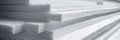 Stacked foam plastic sheets ready for installation, emphasizing the thickness and size of the insulation material. Royalty Free Stock Photo