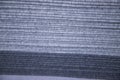 Stacked folded Gray fabric Surface Texture Background. Selective Focus