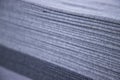Stacked folded Gray fabric Surface Texture Background. Selective Focus