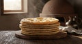 Stacked Freshly Baked Flatbreads with Steam, Rustic Oven, and Wooden Table Royalty Free Stock Photo