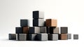 Stacked geometric cubes arranged in pyramid formation on plain background Royalty Free Stock Photo