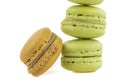 Stacked green and brown cake macaron on white background, maccarone sweet dessert