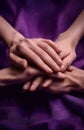 Stacked Hands Showing Support And Care On Purple Background Royalty Free Stock Photo