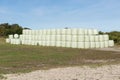 Stacked hay bales wrapped in plastic Royalty Free Stock Photo