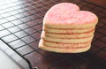 Stacked heart shaped valentines day cookies on cooling rack Royalty Free Stock Photo