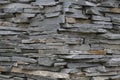 Stacked horizontal gray stone plates