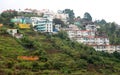 Stacked houses built and trees on the kodaikanal tour place. Royalty Free Stock Photo