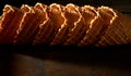 Stacked ice cream waffle cones on shadowy wood Royalty Free Stock Photo