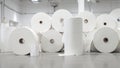 Stacked industrial paper rolls in a bright clean paper mill Royalty Free Stock Photo