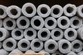 Stacked insulation for pipes of polyethylene foam in warehouse Royalty Free Stock Photo