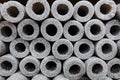 Stacked insulation for pipes of polyethylene foam in warehouse Royalty Free Stock Photo