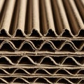 Stacked layers of corrugated cardboard, showcasing a wavy, fluted structure between Royalty Free Stock Photo