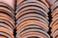 Stacked laying down clay roofing tiles