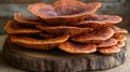 Stacked medicinal mushrooms on wooden slice Royalty Free Stock Photo