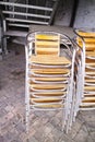 stacked metal chairs near a restaurant Royalty Free Stock Photo