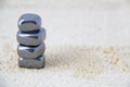 Stacked Metallic Stones on Sand