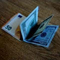 Stacked money: dollars and euros. Royalty Free Stock Photo